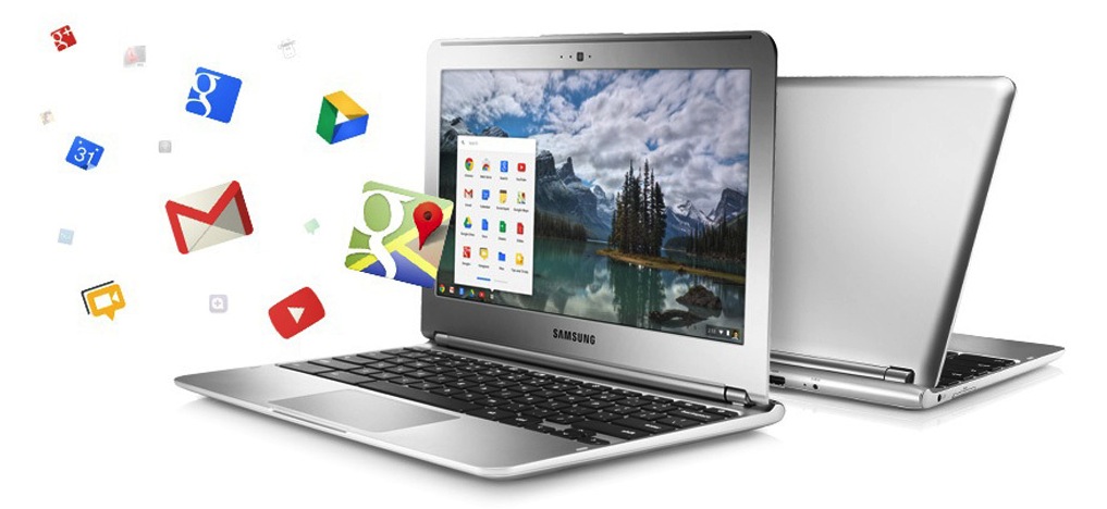 Two Chromebooks, back to back, on a white background. Icons for Google's apps are flying from the screen of the foremost Chromebook.